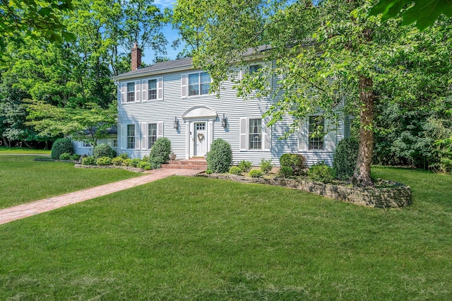 2 Seaview Ln, Mount Sinai, NY 11766 - colonial inspired home with a chimney and a front lawn