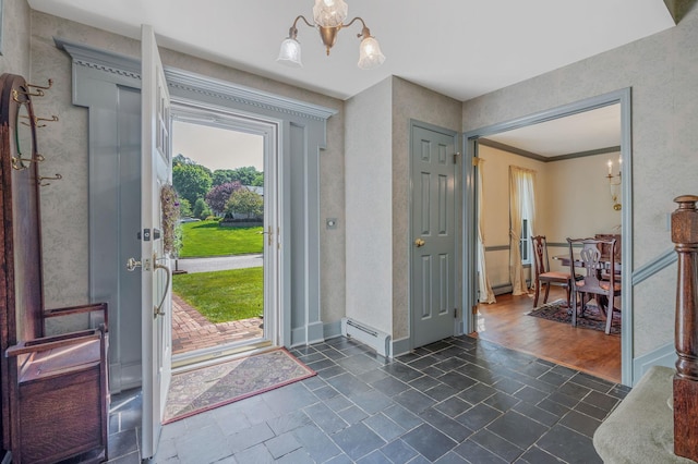 2 Seaview Ln, Mount Sinai, NY 11766 - foyer featuring a chandelier and baseboards