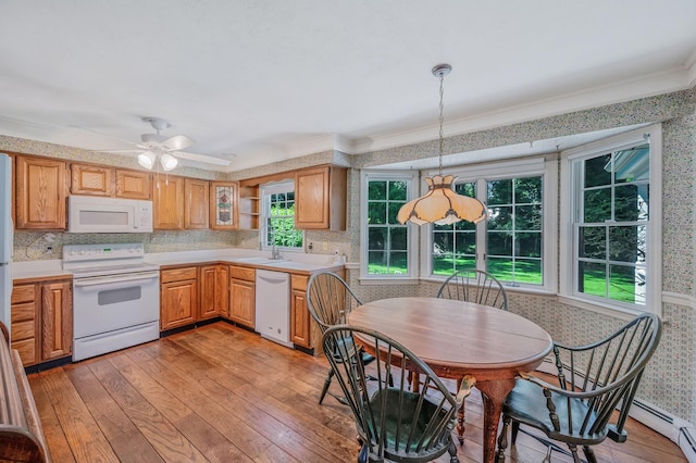2 Seaview Ln, Mount Sinai, NY 11766 - kitchen with white appliances, wallpapered walls, ornamental molding, light wood-type flooring, and light countertops