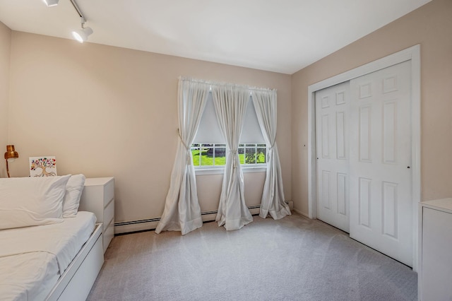 2 Seaview Ln, Mount Sinai, NY 11766 - living area featuring light colored carpet, track lighting, and baseboard heating