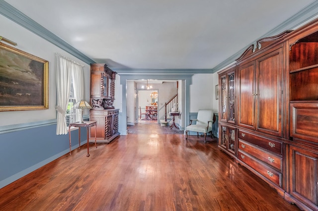 2 Seaview Ln, Mount Sinai, NY 11766 - sitting room with dark wood finished floors, stairs, ornamental molding, and a chandelier