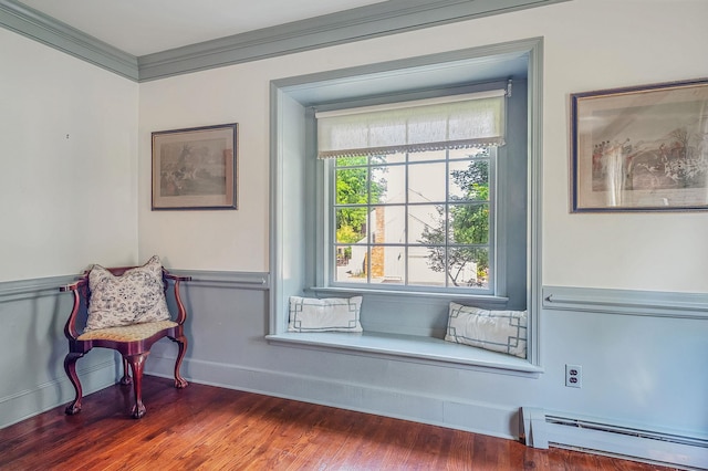 2 Seaview Ln, Mount Sinai, NY 11766 - living area featuring a baseboard heating unit, ornamental molding, and wood finished floors