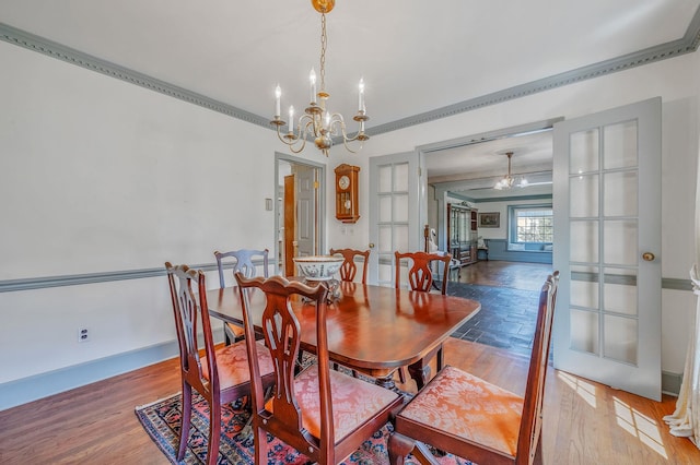 2 Seaview Ln, Mount Sinai, NY 11766 - dining area featuring a chandelier, ornamental molding, and wood finished floors