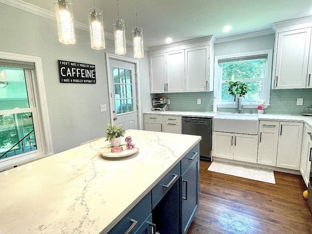 12 Russell Rd, Wappingers Falls, NY 12590 - kitchen featuring dishwashing machine, crown molding, backsplash, white cabinets, and pendant lighting