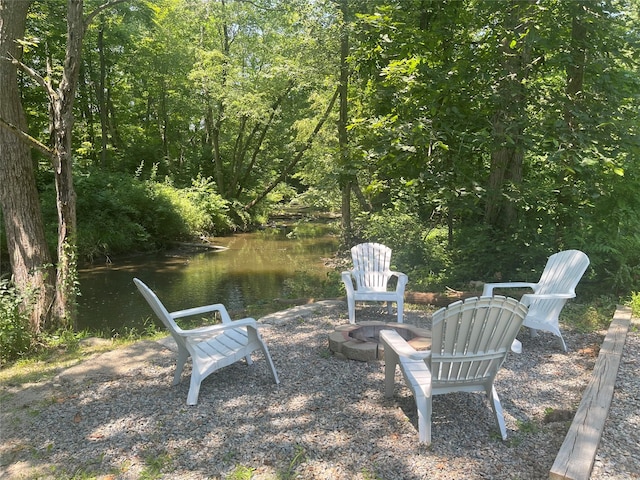 12 Russell Rd, Wappingers Falls, NY 12590 - view of yard featuring a fire pit and a wooded view