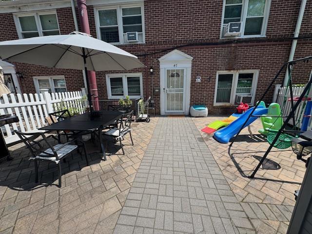 47 Hilltop Acres Unit 47, Yonkers, NY 10704 - view of patio featuring cooling unit and outdoor dining space