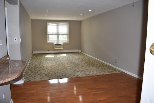 596 Broadway Unit 10B, Lynbrook, NY 11563 - empty room featuring wood finished floors, recessed lighting, and an AC wall unit