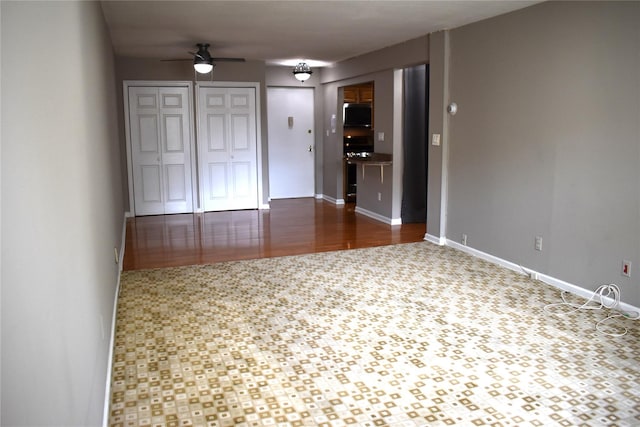 596 Broadway Unit 10B, Lynbrook, NY 11563 - unfurnished room featuring a ceiling fan and baseboards