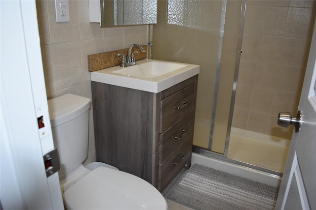 596 Broadway Unit 10B, Lynbrook, NY 11563 - full bath featuring tile walls, a stall shower, vanity, and backsplash