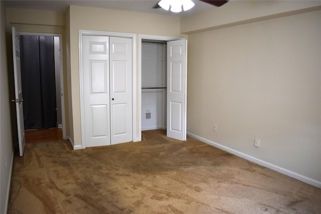 596 Broadway Unit 10B, Lynbrook, NY 11563 - unfurnished bedroom with carpet flooring, multiple closets, and a ceiling fan