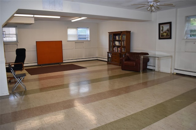 596 Broadway Unit 10B, Lynbrook, NY 11563 - unfurnished office with a baseboard heating unit, a ceiling fan, a decorative wall, and baseboard heating