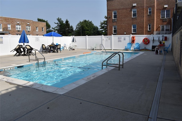 596 Broadway Unit 10B, Lynbrook, NY 11563 - community pool featuring a patio area