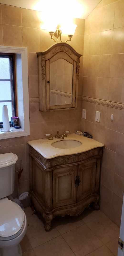13035 126th S, Ozone Park, NY 11420 - half bathroom with tile walls, vanity, and tile patterned flooring