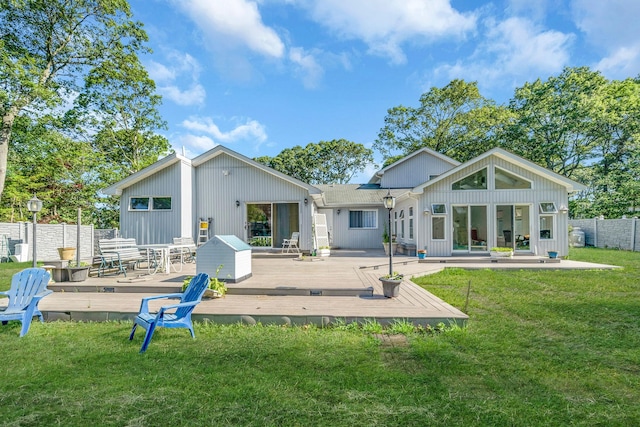 26 Liber Blvd, Farmingville, NY 11738 - rear view of house with board and batten siding and a deck