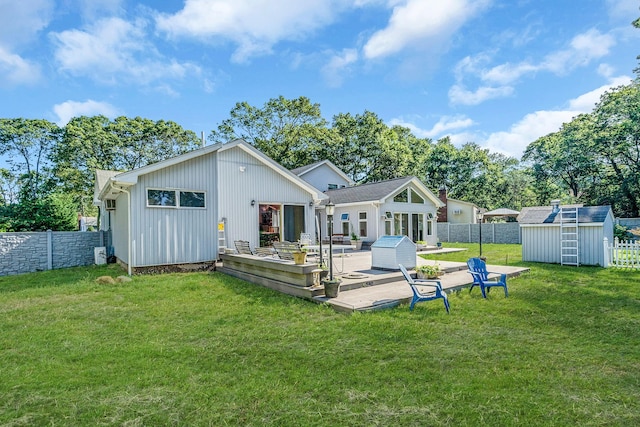 26 Liber Blvd, Farmingville, NY 11738 - rear view of house featuring a fenced backyard, a deck, and a storage shed