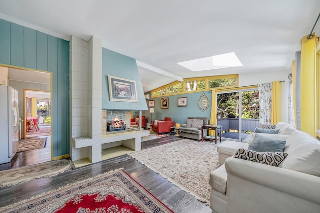 26 Liber Blvd, Farmingville, NY 11738 - living room with a skylight, wood finished floors, and vaulted ceiling