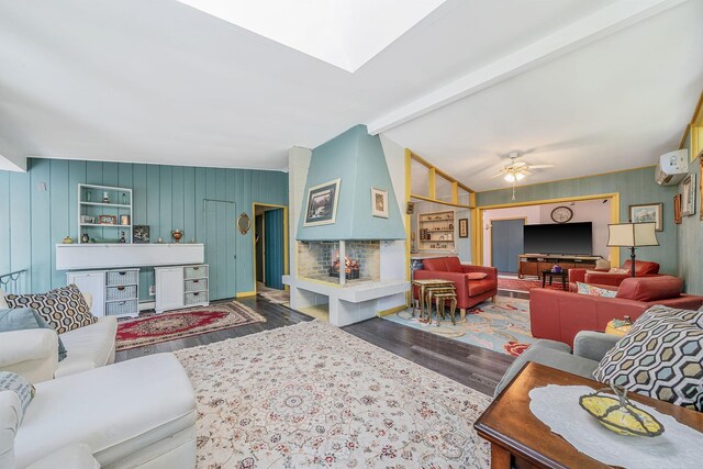 26 Liber Blvd, Farmingville, NY 11738 - living room with wood finished floors, ceiling fan, a wall mounted air conditioner, and beamed ceiling