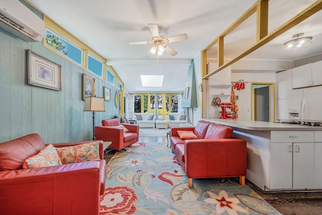 26 Liber Blvd, Farmingville, NY 11738 - living area with a skylight, a wall unit AC, a ceiling fan, and wood walls