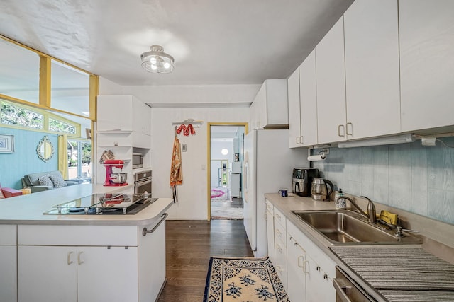 26 Liber Blvd, Farmingville, NY 11738 - kitchen with black electric stovetop, dark wood finished floors, light countertops, and white cabinetry