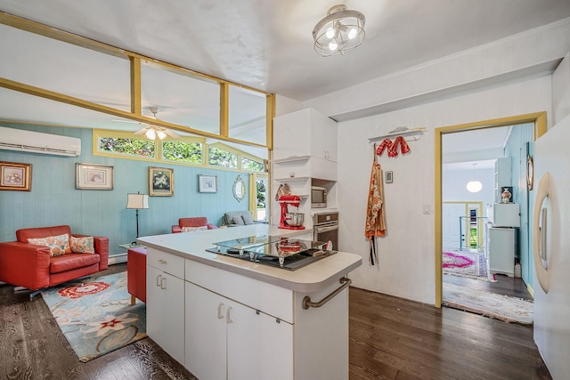 26 Liber Blvd, Farmingville, NY 11738 - kitchen with appliances with stainless steel finishes, dark wood finished floors, a wall mounted AC, ceiling fan, and plenty of natural light