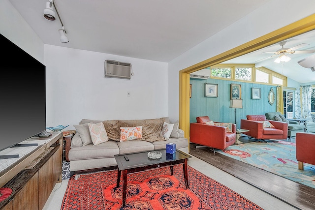 26 Liber Blvd, Farmingville, NY 11738 - living area with a wall unit AC, ceiling fan, an AC wall unit, lofted ceiling, and light wood-style floors