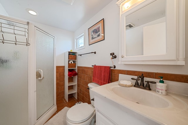 26 Liber Blvd, Farmingville, NY 11738 - full bath with tile walls, a shower stall, vanity, wainscoting, and tile patterned floors