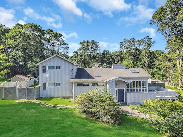 26 Liber Blvd, Farmingville, NY 11738 - back of property with a deck and a shingled roof