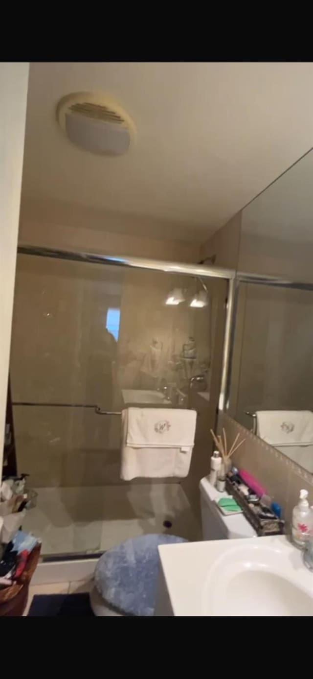 180 Bch 101st St Unit 3C, Rockaway Beach, NY 11694 - bathroom featuring vanity and a stall shower