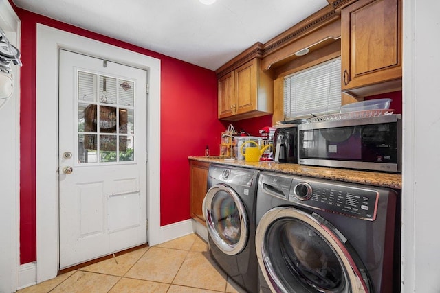 19 Russell St, Roslyn Heights, NY 11577 - laundry area with separate washer and dryer, light tile patterned flooring, and cabinet space