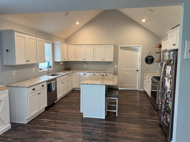 153 Ridgewood Ave, Middletown, NY 10940 - kitchen with stainless steel appliances, white cabinetry, a center island, recessed lighting, and light stone countertops