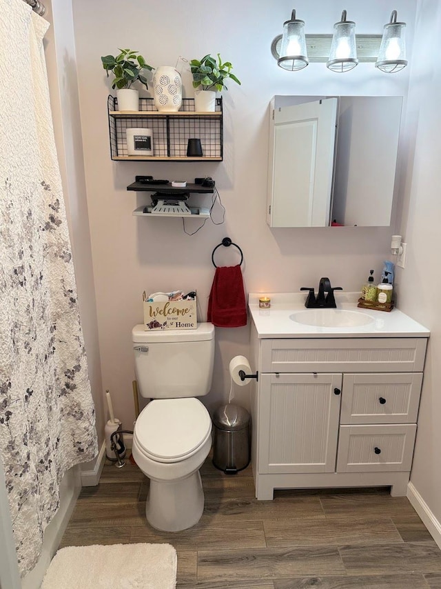 153 Ridgewood Ave, Middletown, NY 10940 - full bathroom with vanity, wood finished floors, and curtained shower