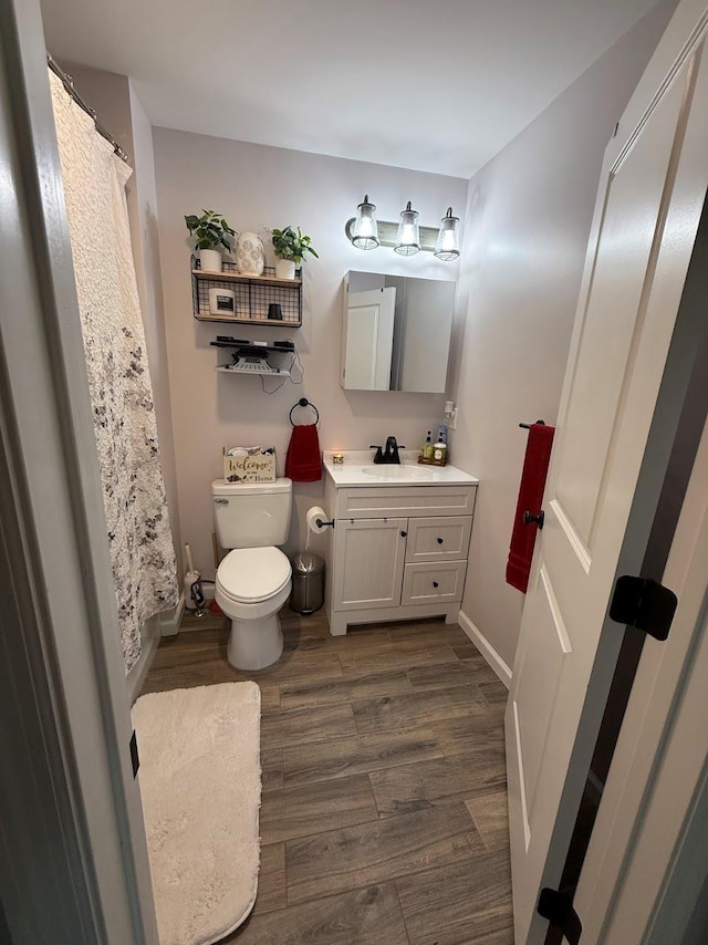 153 Ridgewood Ave, Middletown, NY 10940 - full bath with vanity, wood finished floors, and a shower with shower curtain