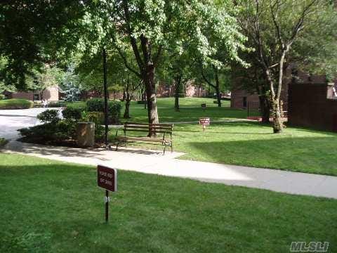 150-15 72nd Rd Unit 4G, Flushing, NY 11367 - view of community featuring a lawn