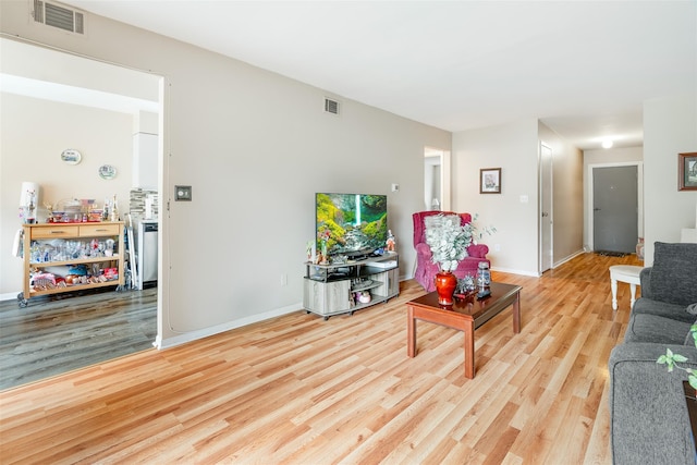26 Cooper Rd Unit 416, Poughkeepsie, NY 12603 - living area featuring wood finished floors and baseboards