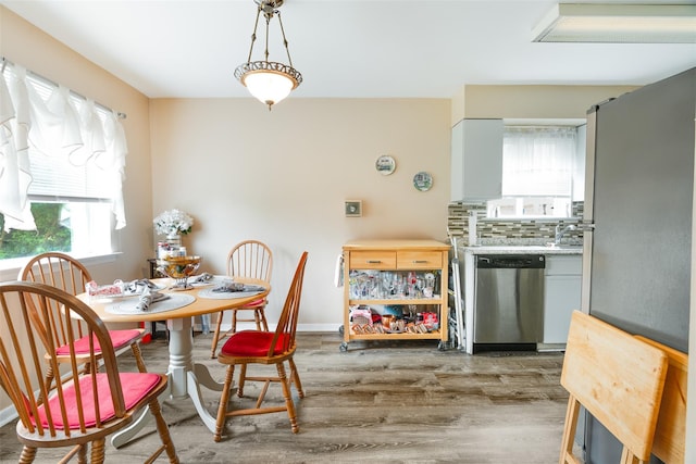26 Cooper Rd Unit 416, Poughkeepsie, NY 12603 - dining area featuring wood finished floors and baseboards