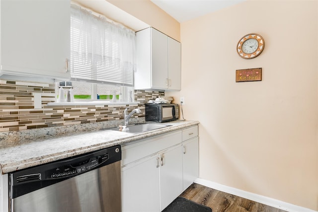 26 Cooper Rd Unit 416, Poughkeepsie, NY 12603 - kitchen featuring stainless steel dishwasher, backsplash, black microwave, and white cabinets