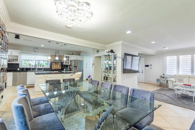 17 Hicks Ln, Great Neck, NY 11024 - dining area featuring light tile patterned floors, crown molding, recessed lighting, and a chandelier