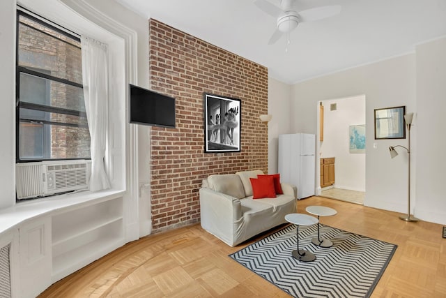 293 Riverside Dr Unit 4B, New York Manhattan, NY 10025 - living area featuring a ceiling fan, cooling unit, and brick wall