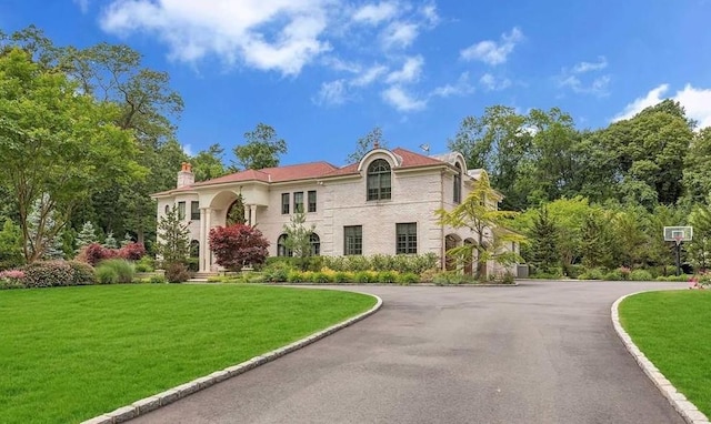 11 Black Rock Rd, Muttontown, NY 11545 - view of front facade with a front lawn, a chimney, and asphalt driveway