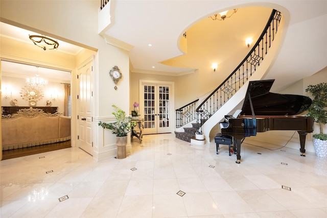 11 Black Rock Rd, Muttontown, NY 11545 - foyer entrance featuring ornamental molding, french doors, stairs, a chandelier, and arched walkways