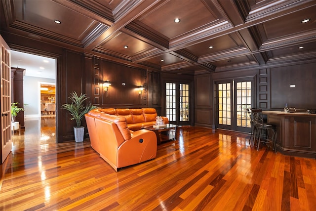 11 Black Rock Rd, Muttontown, NY 11545 - living area featuring wood finished floors, a decorative wall, ornamental molding, coffered ceiling, and beamed ceiling