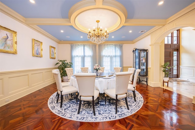 11 Black Rock Rd, Muttontown, NY 11545 - dining area with a decorative wall, a chandelier, crown molding, arched walkways, and wainscoting
