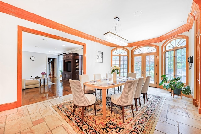 11 Black Rock Rd, Muttontown, NY 11545 - dining space featuring stone tile flooring, crown molding, and french doors