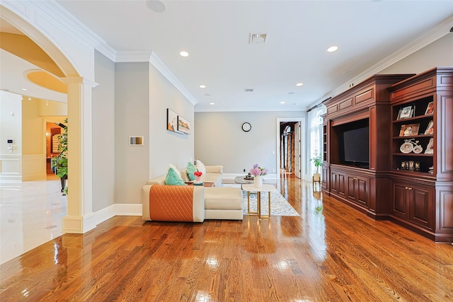 11 Black Rock Rd, Muttontown, NY 11545 - living area with decorative columns, light wood-type flooring, arched walkways, recessed lighting, and ornamental molding
