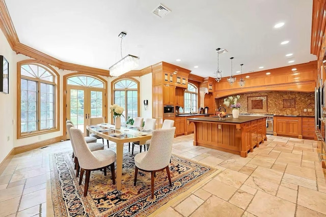 11 Black Rock Rd, Muttontown, NY 11545 - dining area featuring stone tile floors, recessed lighting, french doors, and crown molding