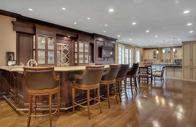 11 Black Rock Rd, Muttontown, NY 11545 - community bar area with ornamental molding, recessed lighting, backsplash, wood finished floors, and hanging light fixtures