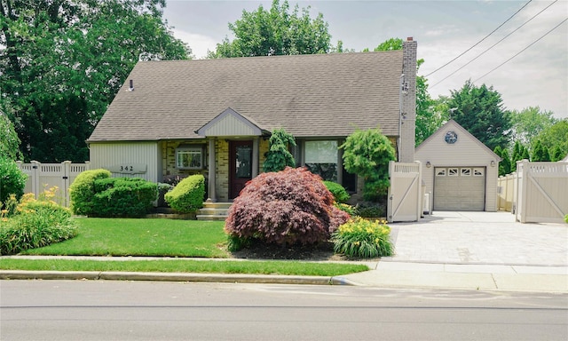 342 Mildred St, Oceanside, NY 11572 - view of front facade featuring a gate, a garage, driveway, roof with shingles, and a chimney