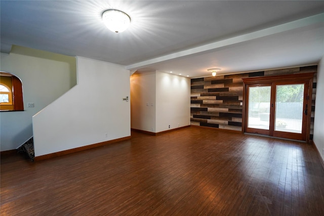 342 Mildred St, Oceanside, NY 11572 - unfurnished living room featuring wood finished floors and stairs