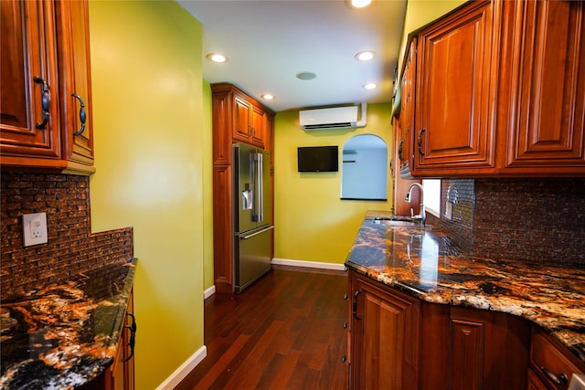 342 Mildred St, Oceanside, NY 11572 - kitchen with high end refrigerator, an AC wall unit, dark wood-style floors, tasteful backsplash, and recessed lighting