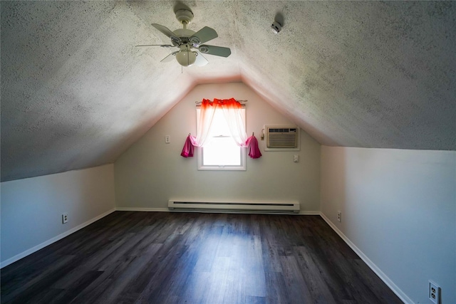 342 Mildred St, Oceanside, NY 11572 - additional living space with baseboard heating, a wall mounted air conditioner, a textured ceiling, wood finished floors, and a ceiling fan